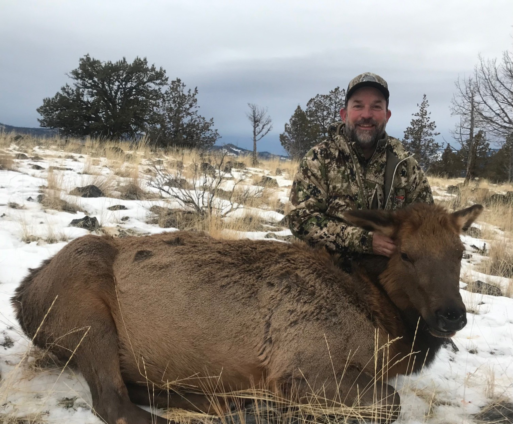 John Childs with a cow elk taken with a 6.5 Creedmoor