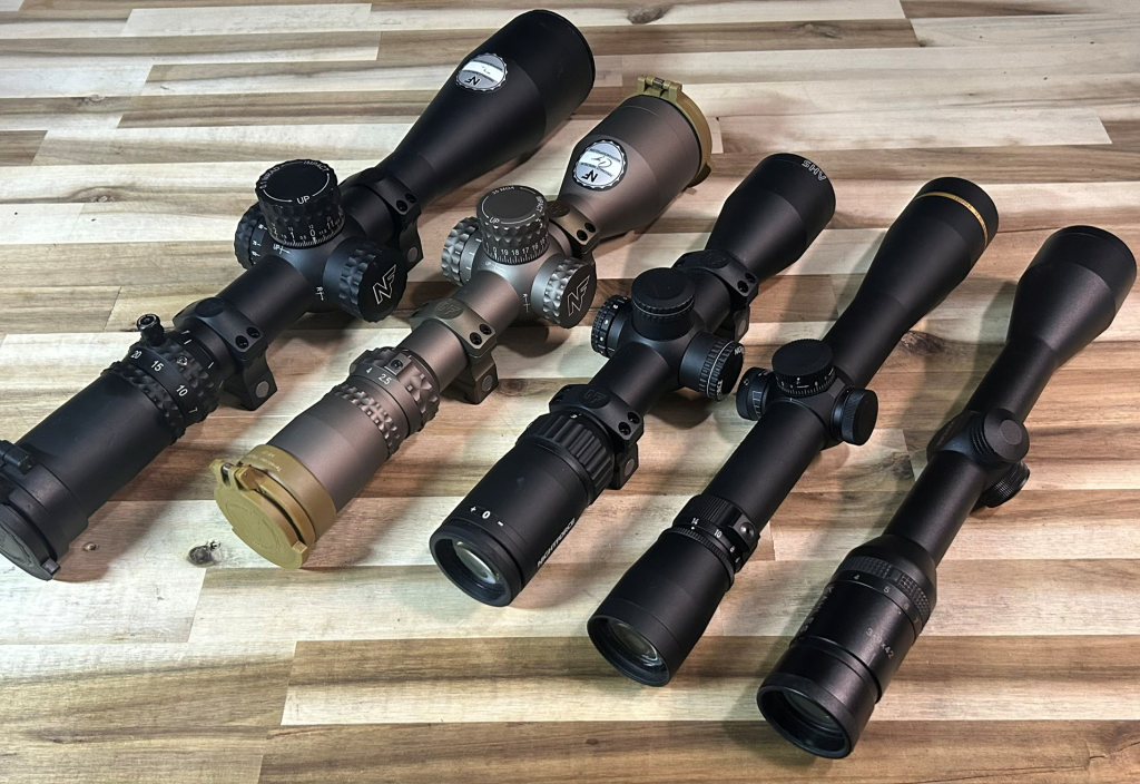 Rifle scopes with different magnification ranges and optical configurations