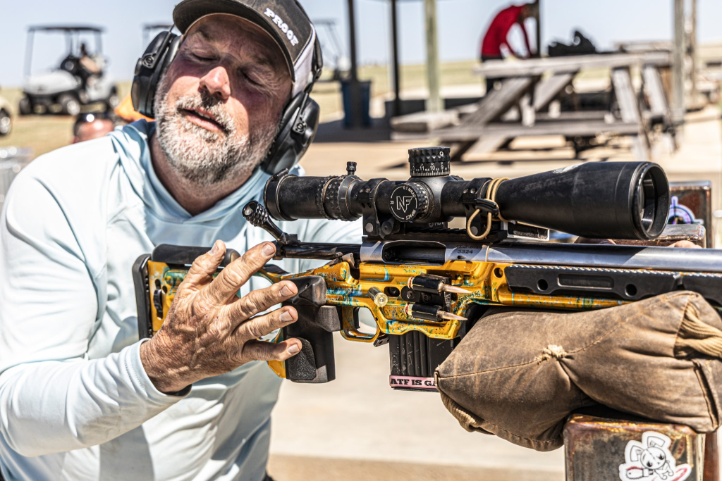 Precision rifle shooter reacting after a missed shot during a competition