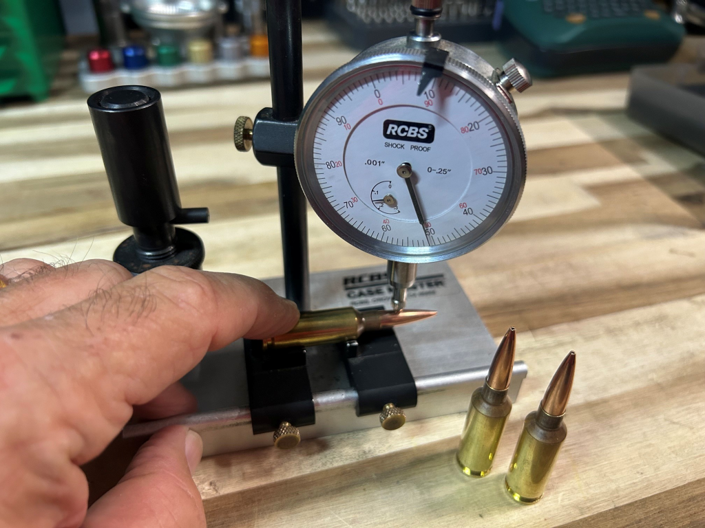 Measuring bullet runout on a loaded precision rifle cartridge with a concentricity gauge