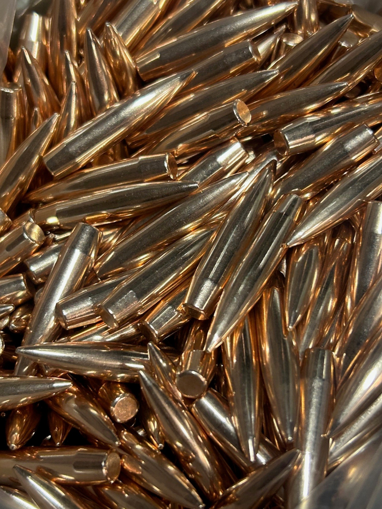 Pile of rifle bullets used as components for reloading ammunition